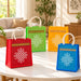 Kolam print jute burlap tote bags in red green yellow and blue with white geometric patterns and cream handles ideal for Indian gifts