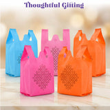 Brightly colored blue pink and orange kolam print non woven reusable bags with black geometric patterns for Indian weddings