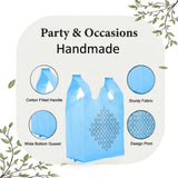 Light blue handmade kolam print party bag with geometric design and cotton filled handles for Indian wedding favors