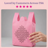 Pink reusable non woven shopping bag with black geometric kolam print for Indian wedding party favors and ecofriendly use