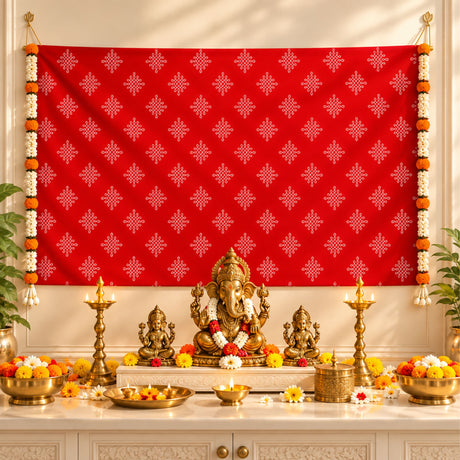 Golden ganesha statue adorned with floral garland seated on ornate pedestal with kolam rangoli print backdrop and artificial marigold jasmine garlands for diwali pooja weddings housewarming