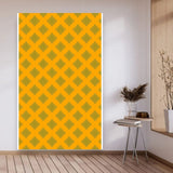 Bright yellow kolam rangoli backdrop with intricate green geometric patterns and artificial marigold and jasmine garlands for festival decoration