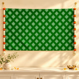 Green tapestry kolam rangoli print backdrop with white geometric patterns and orange white floral garlands for diwali and weddings