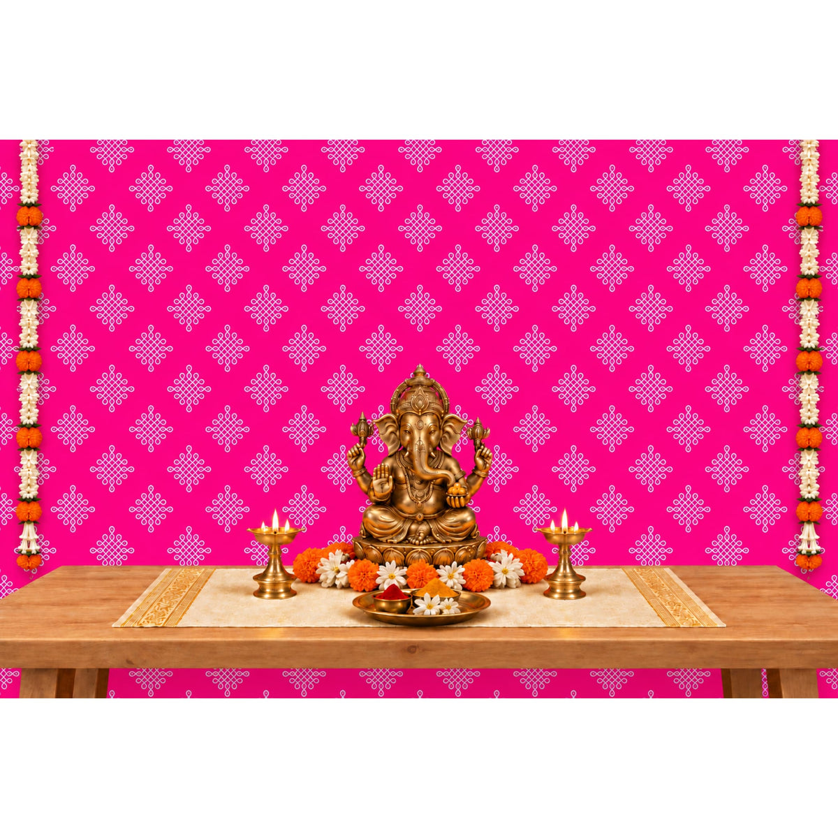 Golden ganesha statue with intricate detailing and traditional seated pose featured with kolam rangoli backdrop and floral garlands