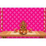 Golden ganesha statue with intricate detailing and traditional seated pose featured with kolam rangoli backdrop and floral garlands
