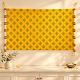 Bright yellow kolam rangoli print backdrop with dark green geometric pattern and artificial marigold jasmine garlands