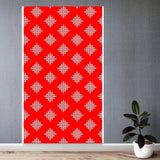 A vibrant red kolam rangoli backdrop panel with intricate white geometric designs and artificial marigold and jasmine garlands for diwali and festive decorations