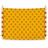 Vibrant yellow kolam rangoli print backdrop with dark brown geometric patterns and 2 artificial marigold and jasmine garlands