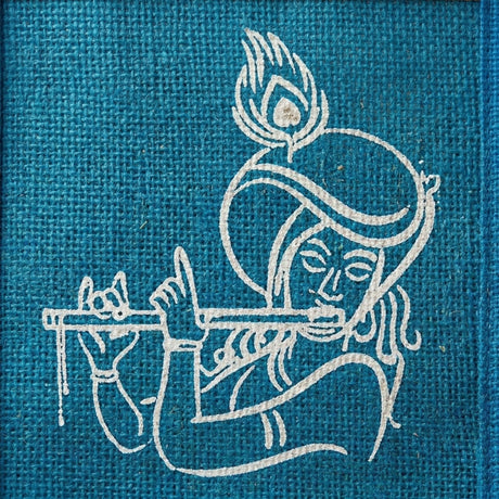 White embroidered figure playing flute on teal fabric jute bag with krishna print reusable tote for wedding gifts