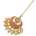 A delicate coral and gold jhumka earring with enamel work and pearls inspired by kundan chand tikka design