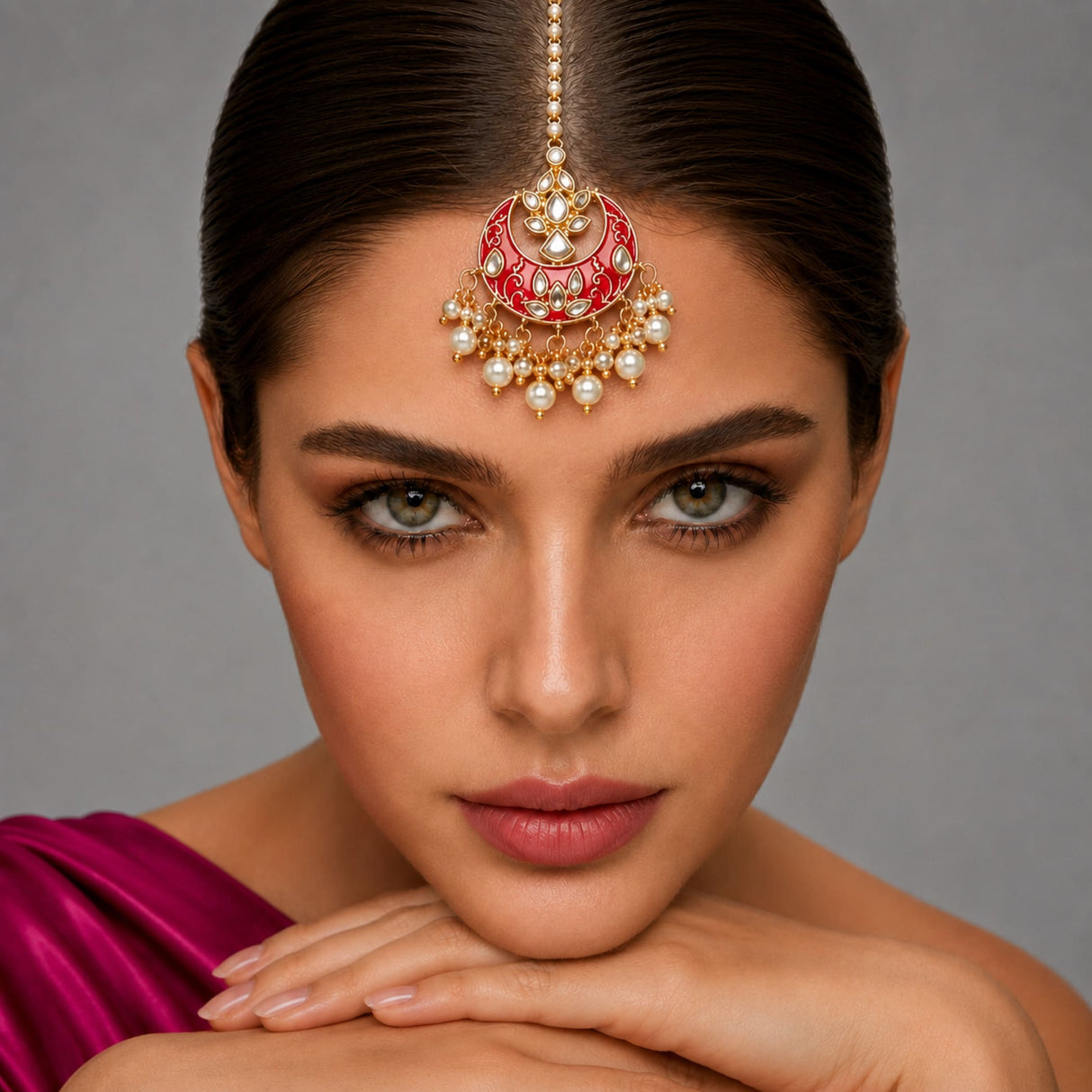 Kundan chand tikka gold plated maang tikka with red and gold ornate design and pearl adornments for indian weddings