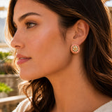 Indian kundan stud earring with pinkish-gold floral frame and intricate detailing in golden tone for bridal wear
