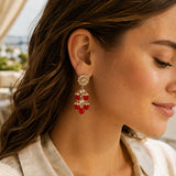 Gold-toned Indian floral kundan stone and faux pearl earrings with red gemstones for diwali and wedding wear
