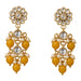 Gold tone floral kundan stone earrings with clear stones, red gemstones, and faux pearls for diwali and weddings