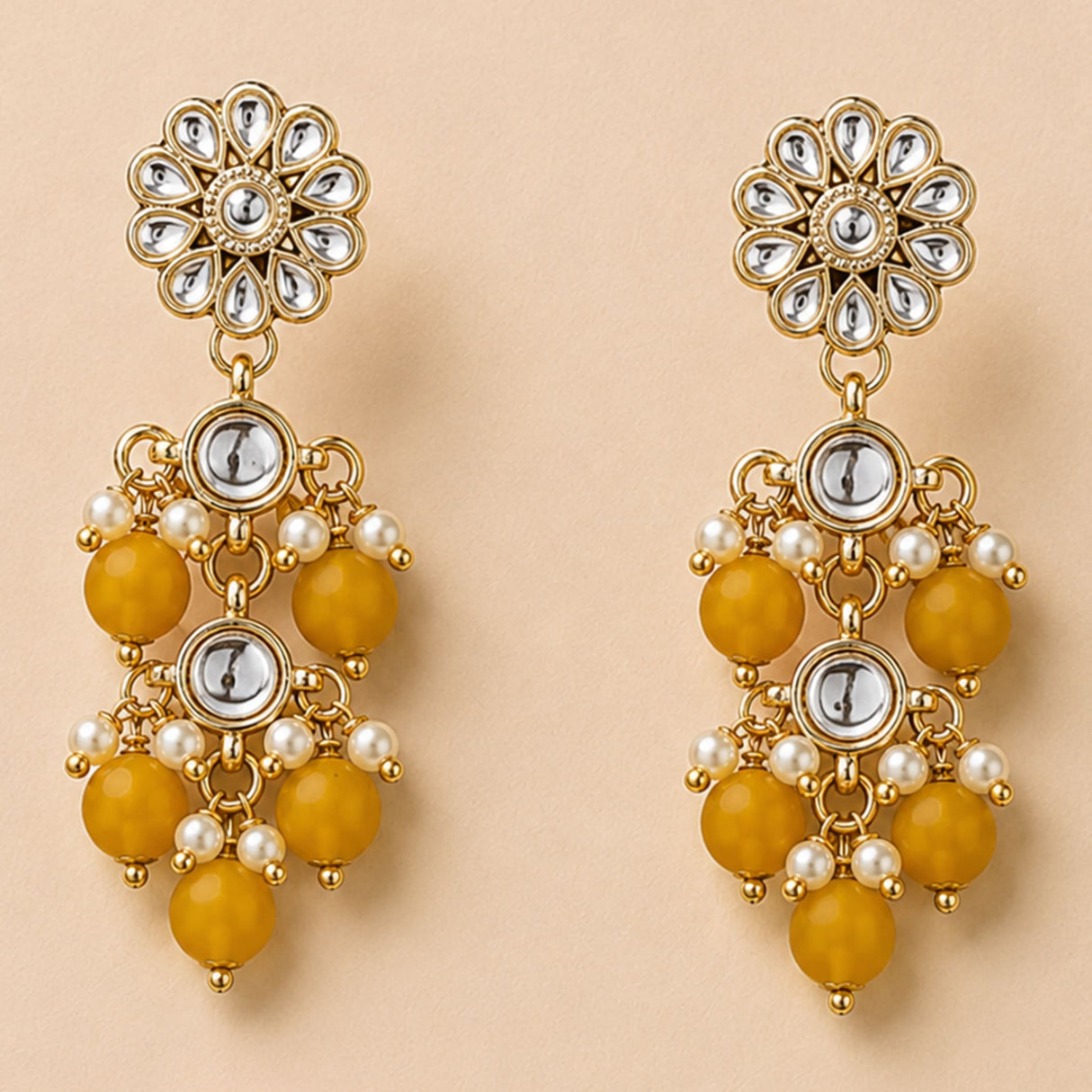 Gold-toned Indian floral kundan stone earrings with clear stones amber beads pearls and silver discs for ethnic wear