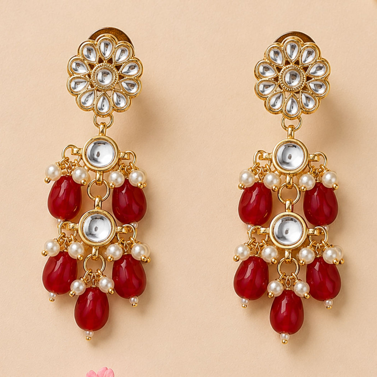 Gold-toned indian floral kundan stone earrings with clear stones red teardrop beads and faux pearls for ethnic wear