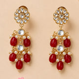 Gold-toned indian floral kundan stone earrings with clear stones red teardrop beads and faux pearls for ethnic wear
