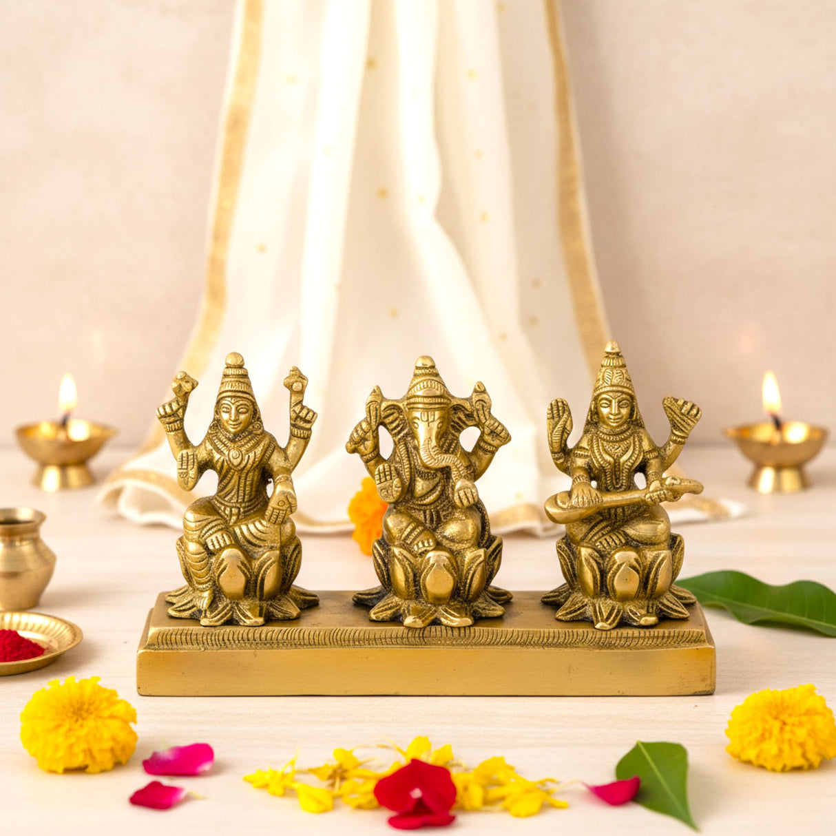 3-inch golden brass Ganesha Lakshmi Saraswati figurines on base