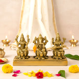 3-inch golden brass Ganesha Lakshmi Saraswati figurines on base
