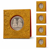 Golden textured coin display case holding a silver laxmi-narayan commemorative coin for diwali and pooja gifts