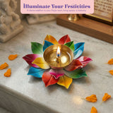 Vibrant multicolored brass lotus diya with golden center and lit wick for indian traditional pooja and diwali decor