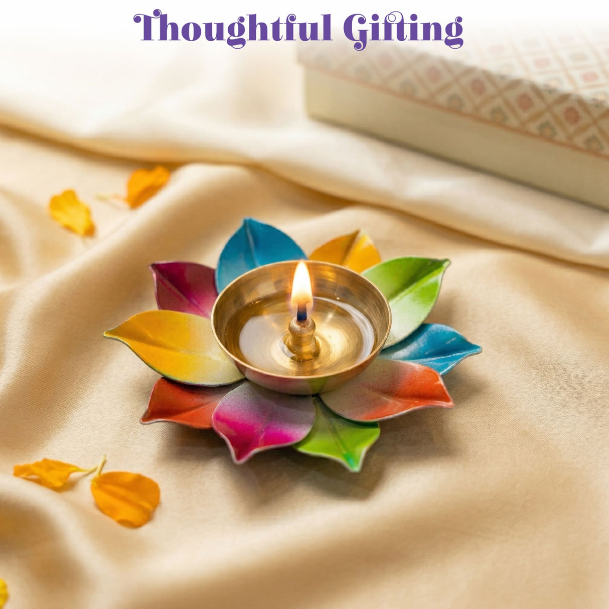 A colorful multi-hued brass lotus diya with a lit candle for home pooja room Diwali mandir temple decor