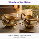 Golden brass lotus diya oil lamp with intricate floral engravings and handle for indian pooja and diwali decor