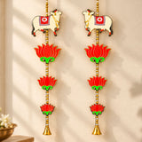Pair of white cow wall hangings with red and gold lotus flowers and bells for Indian festival decor and pooja