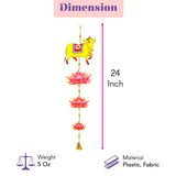 A 24-inch decorative hanging wind chime with a yellow cow, pink lotus flowers, and a golden bell for Indian festival decor