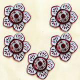 Red and silver floral-shaped decorative buttons with intricate cut-out patterns for lotus haldi kumkum holder pooja favor