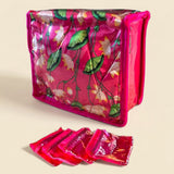 Vibrant pink lotus print satin indian jewelry box pouch with transparent zippered compartments for travel storage