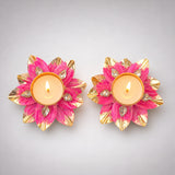 Vibrant pink and gold lotus tealight candle holders with sparkling crystal accents for Diwali pooja and home decor