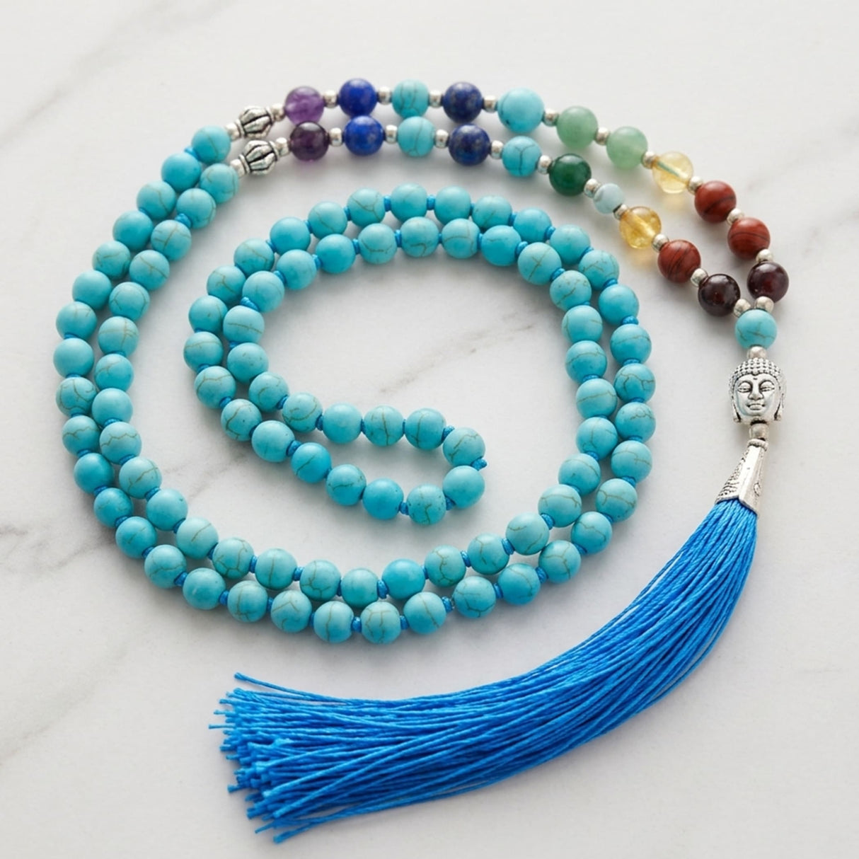 Lovenspire turquoise stone mala necklace with silver buddha head pendant and blue tassel for meditation and healing