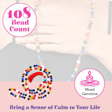 A colorful LOVENSPIRE 108 bead natural healing crystal mala necklace with a red tassel for meditation and yoga