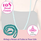 A coiled string of 108 turquoise lovenspire mala beads made of natural healing crystals with a matching tassel for meditation