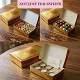 Golden mithai gift box with intricate orange and green mandala design and decorative border for Indian sweets