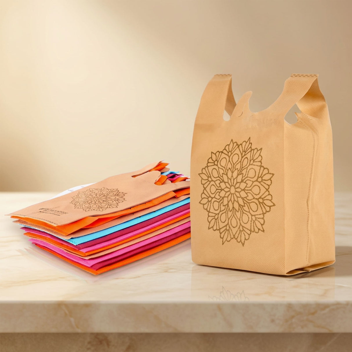 Beige reusable non woven shopping bag with gold mandala design and reinforced handles for indian wedding gifts