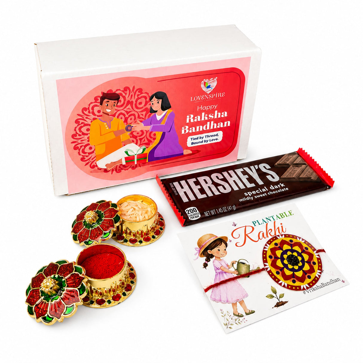 A red and gold floral-design haldi kumkum powder box with lid containing vibrant red powder from designer mandala seed rakhi gift hamper for brother