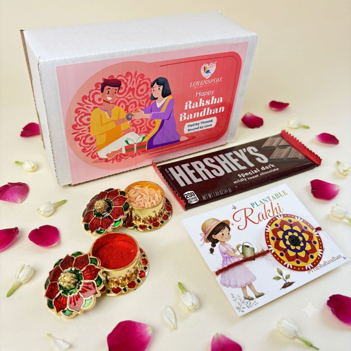 Pink and white gift box labeled happy raksha bandhan by lovenspire for designer mandala seed rakhi hamper