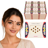 A set of maroon and gold decorative kumkum bindi stickers on a white card with colorful floral borders for Indian wedding favors