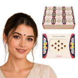 A set of decorative kumkum bindi stickers in vibrant gold and maroon packaging for Indian wedding favors