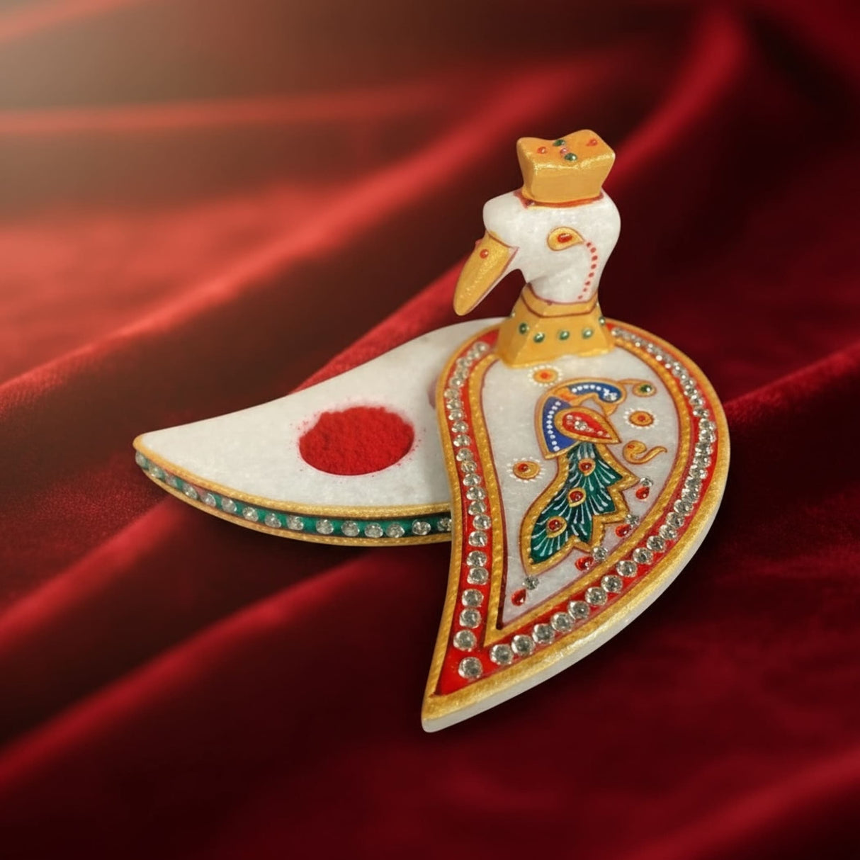 White peacock-shaped marble decorative box with gold accents and red gemstones for Pooja and Diwali decor