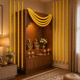 Set of 5 golden marigold strings with ghungroo adorning a wooden altar for diwali and wedding decorations