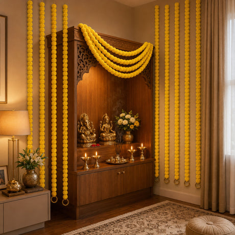 Set of 5 golden marigold strings with ghungroo adorning a wooden altar for diwali and wedding decorations