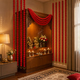 Red floral garlands in a set of 5 marigold strings with ghungroo draped on a wooden altar for diwali and wedding decor