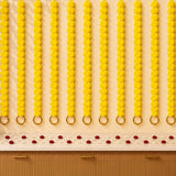 Set of 5 bright yellow marigold garlands with gold-toned ghungroo rings for diwali and indian wedding decoration