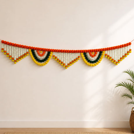 A 9.6 feet jumbo marigold jasmine door toran hanging valance with vibrant orange yellow green pom-poms and white beads