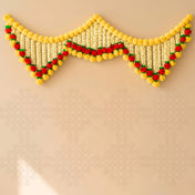 A vibrant yellow and red marigold jasmine floral garland with a decorative wave design for Indian festival decor