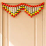 Marigold jasmine door toran hanging valance with vibrant red yellow white pom-poms and green accents for festive decor