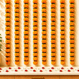 Marigold jhoomar strings decor with vibrant orange flowers and green leaves for mehndi wedding and festive decorations